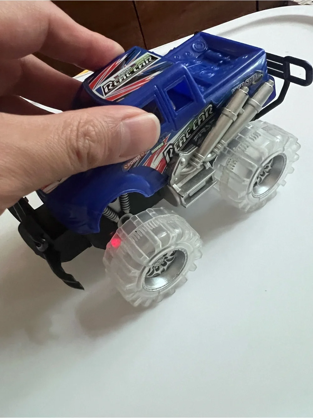 Light-Up Blue Monster Truck Toy – Friction Powered Push & Go Car with LED Tires